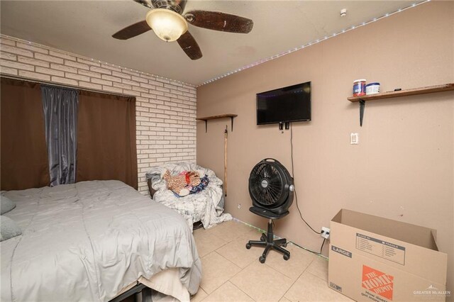 408 E Ebony St, La Feria, TX 78559 - bedroom featuring brick wall, light tile patterned flooring, and a ceiling fan