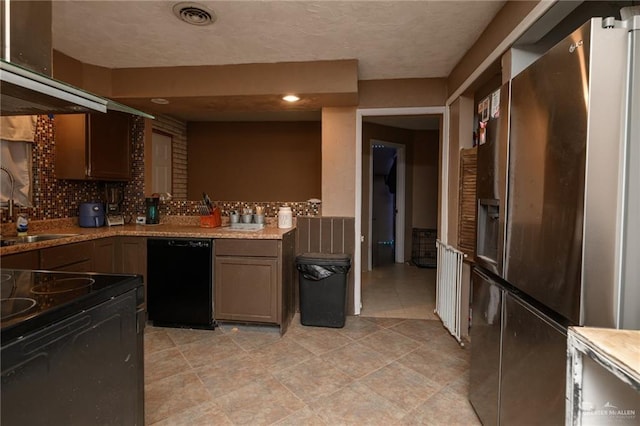408 E Ebony St, La Feria, TX 78559 - kitchen featuring black appliances, backsplash, extractor fan, and recessed lighting