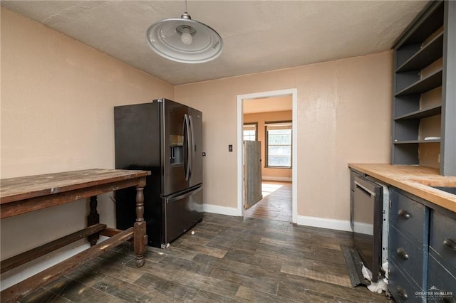 408 E Ebony St, La Feria, TX 78559 - kitchen featuring stainless steel fridge with ice dispenser, wood counters, open shelves, and dark wood finished floors