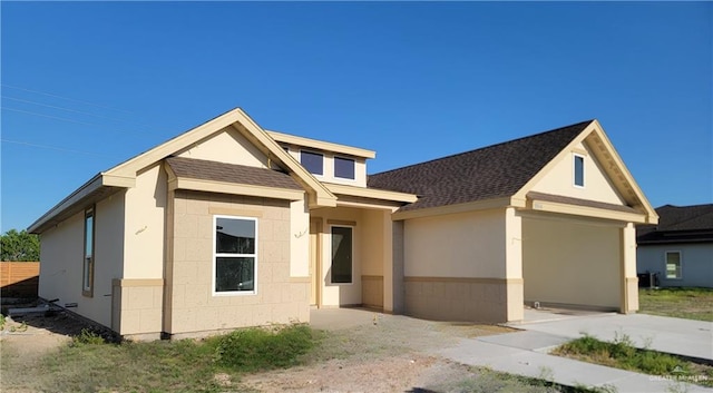 1904 Diplomat Dr, Edinburg, TX 78542 - view of front of house with a shingled roof and stucco siding