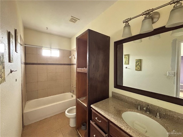 1708 Ivory St, Edinburg, TX 78541 - bathroom featuring vanity, tile patterned floors, toilet, and  shower combination