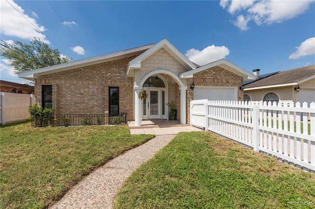 ranch-style house featuring a garage and a front yard