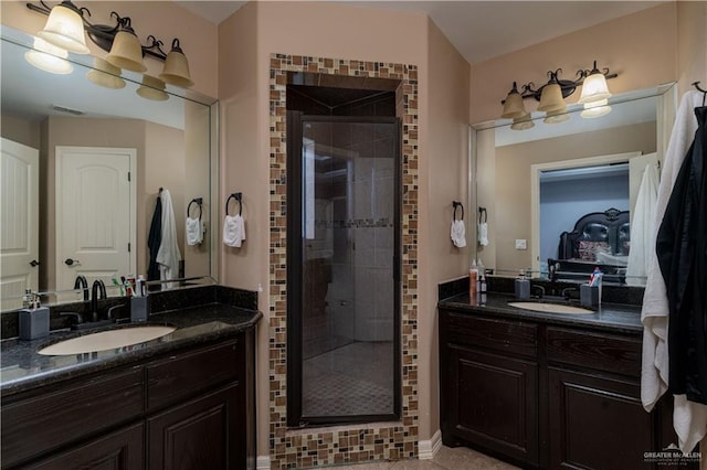 5001 N Ebony St, Pharr, TX 78577 - full bathroom featuring a stall shower, two vanities, and tile patterned flooring