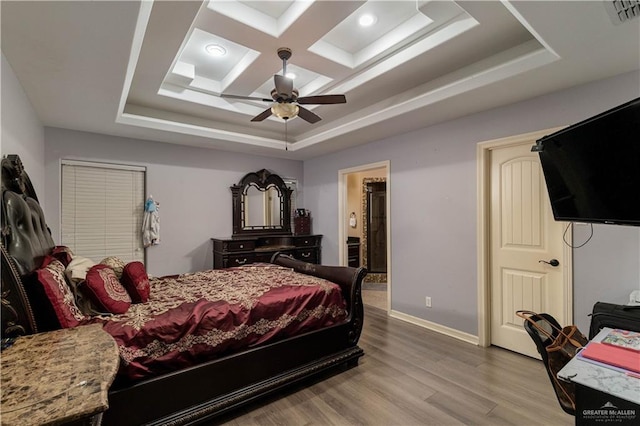5001 N Ebony St, Pharr, TX 78577 - bedroom featuring wood finished floors, a raised ceiling, baseboards, ensuite bathroom, and a ceiling fan
