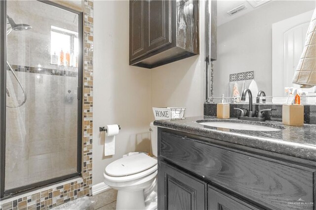 bathroom with visible vents, a shower stall, toilet, tile patterned floors, and vanity