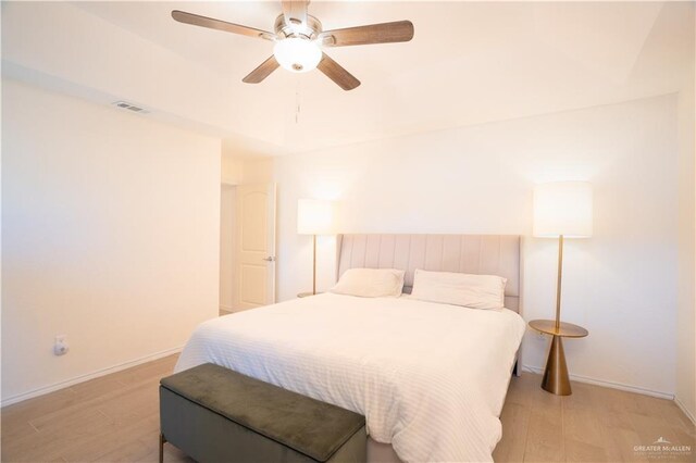 bedroom with ceiling fan and light hardwood / wood-style flooring