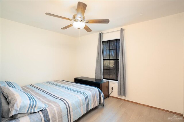 bedroom with ceiling fan and light wood-type flooring