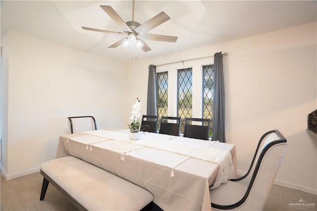 dining space with ceiling fan