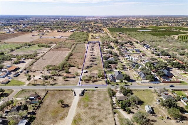 birds eye view of property with a rural view