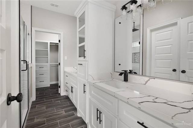 4911 Aguajito St, Edinburg, TX 78542 - bathroom featuring vanity and an enclosed shower