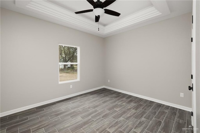 4911 Aguajito St, Edinburg, TX 78542 - unfurnished room featuring dark hardwood / wood-style floors, a raised ceiling, and ceiling fan