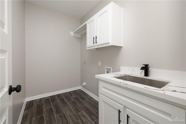 4911 Aguajito St, Edinburg, TX 78542 - laundry area featuring washer hookup, dark hardwood / wood-style floors, cabinets, and sink