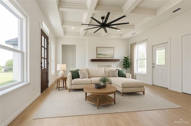 412 S Bowie Ave, Elsa, TX 78538 - living area featuring beamed ceiling, coffered ceiling, light wood-style flooring, and a ceiling fan