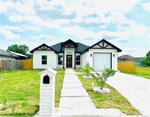 412 S Bowie Ave, Elsa, TX 78538 - view of front of property featuring concrete driveway, a garage, and brick siding