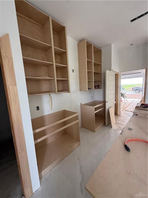132 Finch Ln, Los Fresnos, TX 78566 - kitchen featuring open shelves and light marble finish floors