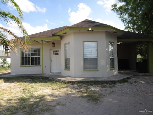 5401 Sunny Cir, Mission, TX 78574 - view of front of home featuring stucco siding and a shingled roof