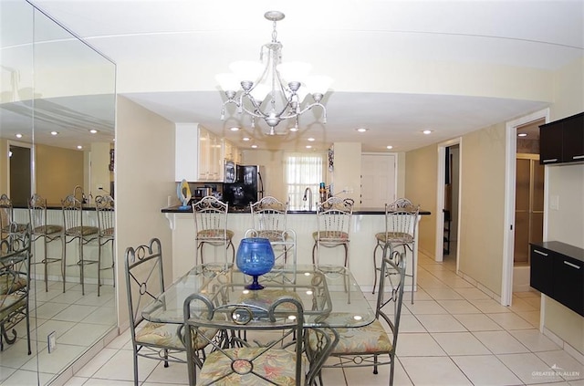 3400 Gulf Blvd Unit 403, South Padre Island, TX 78597 - dining room with a chandelier, light tile patterned floors, and recessed lighting