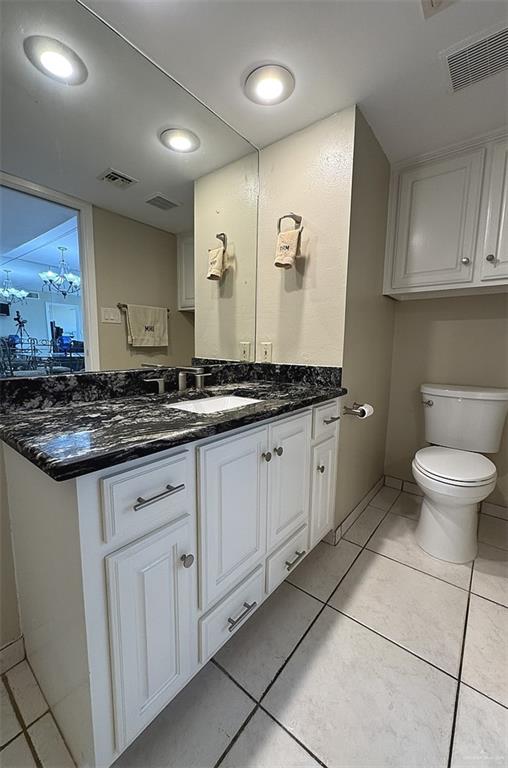3400 Gulf Blvd Unit 403, South Padre Island, TX 78597 - bathroom with vanity, tile patterned flooring, a chandelier, and recessed lighting
