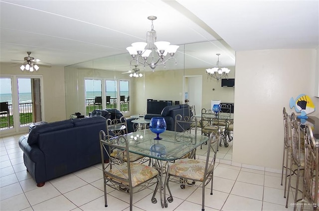 3400 Gulf Blvd Unit 403, South Padre Island, TX 78597 - dining area featuring a chandelier, healthy amount of natural light, light tile patterned flooring, and ceiling fan