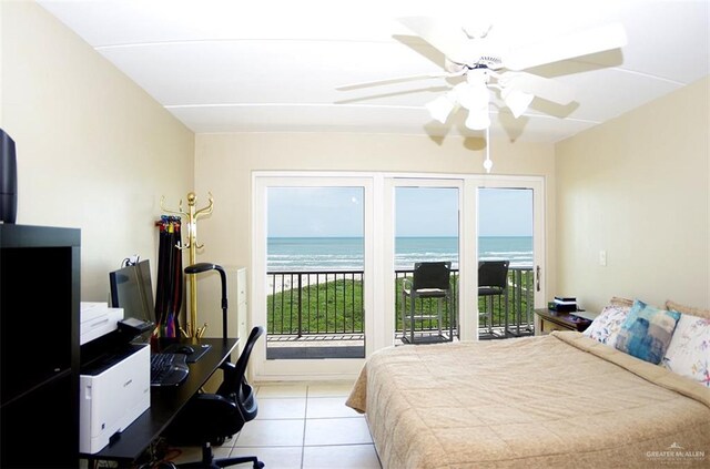 3400 Gulf Blvd Unit 403, South Padre Island, TX 78597 - bedroom featuring access to outside, tile patterned floors, an office area, a water view, and a ceiling fan