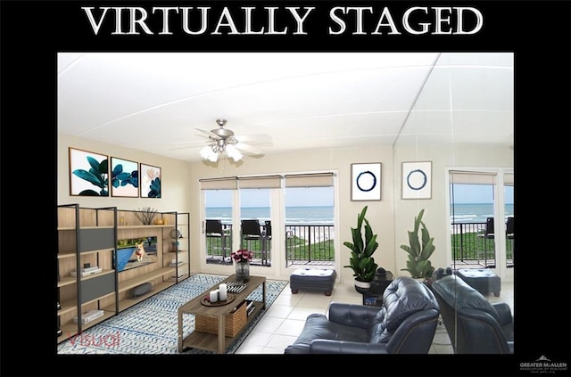 3400 Gulf Blvd Unit 403, South Padre Island, TX 78597 - living room with a ceiling fan, a water view, healthy amount of natural light, and tile patterned floors