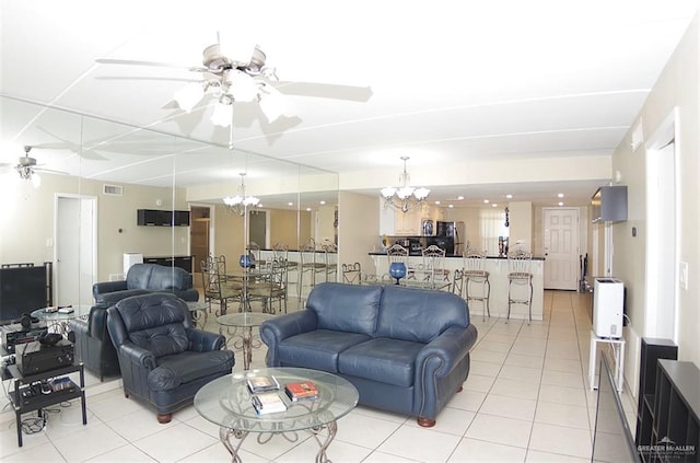 3400 Gulf Blvd Unit 403, South Padre Island, TX 78597 - living room featuring a chandelier, ceiling fan, and light tile patterned floors