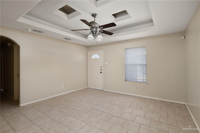 unfurnished room with crown molding, ceiling fan, and a raised ceiling