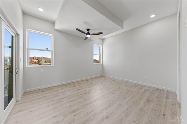 unfurnished room with ceiling fan and light hardwood / wood-style flooring