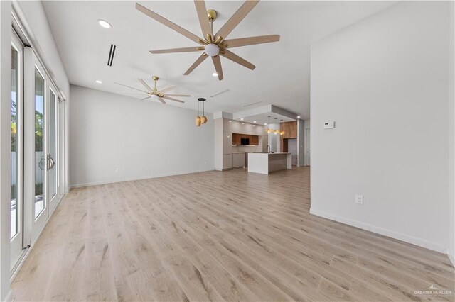 unfurnished living room with light hardwood / wood-style floors and ceiling fan