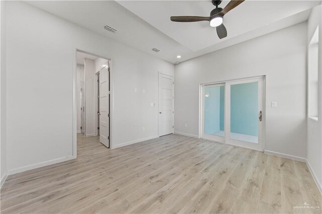 interior space featuring access to exterior, ceiling fan, and light hardwood / wood-style flooring