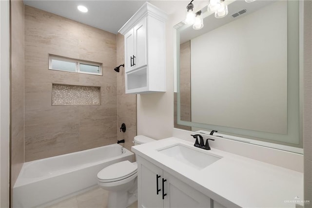 full bathroom featuring shower / washtub combination, visible vents, vanity, and toilet