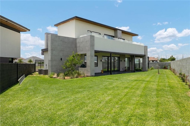 2701 W Duke Dr, Edinburg, TX 78539 - back of property featuring central air condition unit, stucco siding, and a balcony
