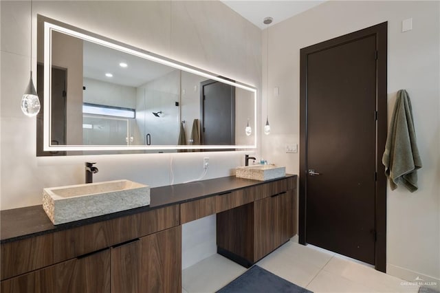 2701 W Duke Dr, Edinburg, TX 78539 - bathroom with double vanity, walk in shower, and tile patterned flooring