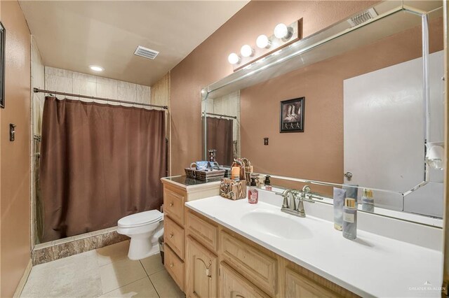 bathroom featuring tile patterned floors, vanity, toilet, and a shower with shower curtain