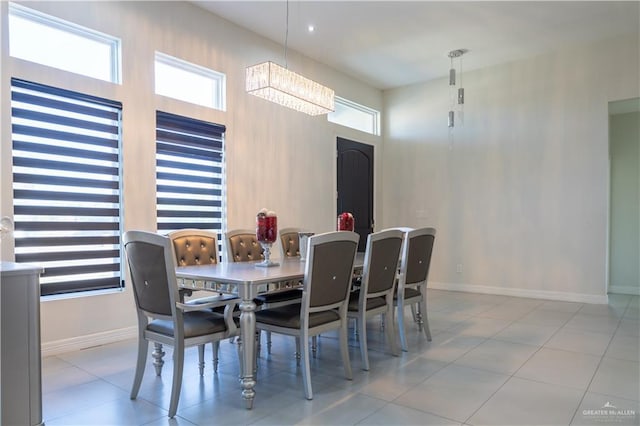 dining area with plenty of natural light and baseboards