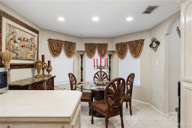 dining area featuring light tile patterned floors