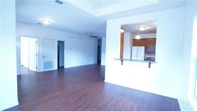 2141 Diaz Ave, Mcallen, TX 78503 - unfurnished living room with dark wood-style flooring and ceiling fan