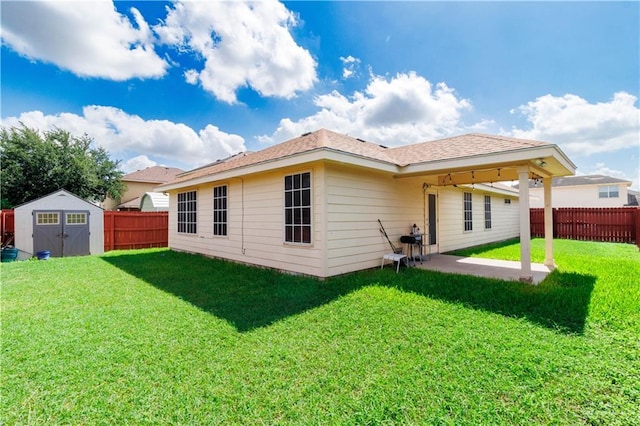 3707 Alvarado St, Edinburg, TX 78539 - back of house with a storage unit, a fenced backyard, and a patio area
