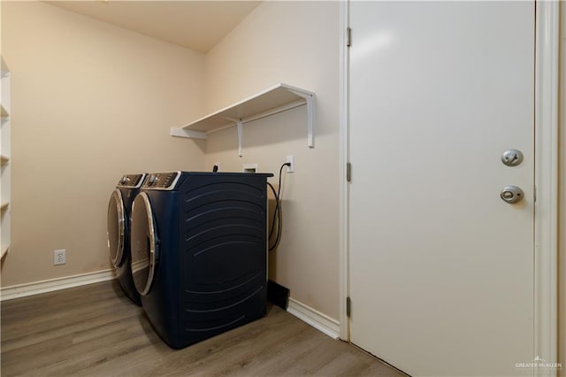 3707 Alvarado St, Edinburg, TX 78539 - laundry room with wood finished floors and independent washer and dryer