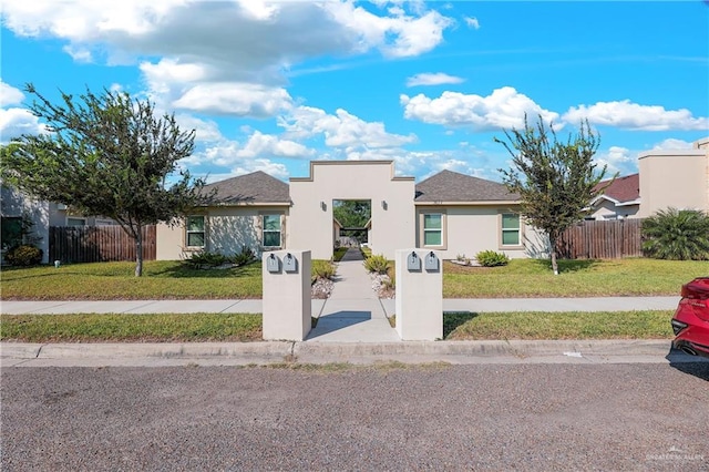 view of front of home featuring a front yard