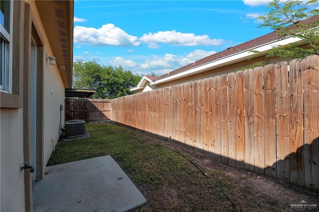 view of yard featuring central AC