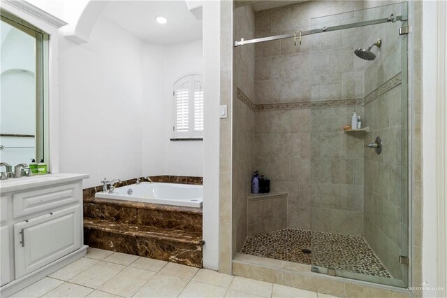 6614 Mile 7 Rd, Mission, TX 78573 - bathroom with a garden tub, vanity, a shower stall, and tile patterned flooring