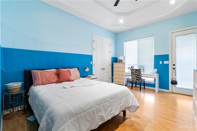 6614 Mile 7 Rd, Mission, TX 78573 - bedroom featuring wood finished floors, a ceiling fan, a tray ceiling, a closet, and recessed lighting