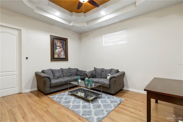 6614 Mile 7 Rd, Mission, TX 78573 - living area featuring baseboards, ceiling fan, a tray ceiling, light wood-style floors, and recessed lighting