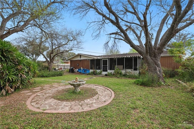 view of yard with a sunroom