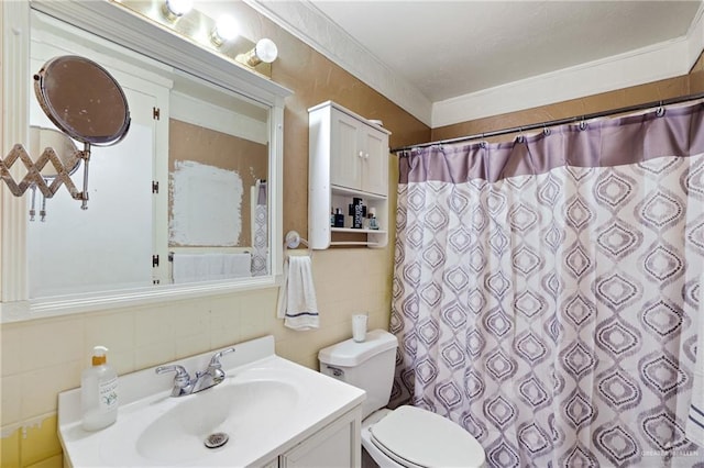 bathroom with vanity, ornamental molding, curtained shower, tile walls, and toilet