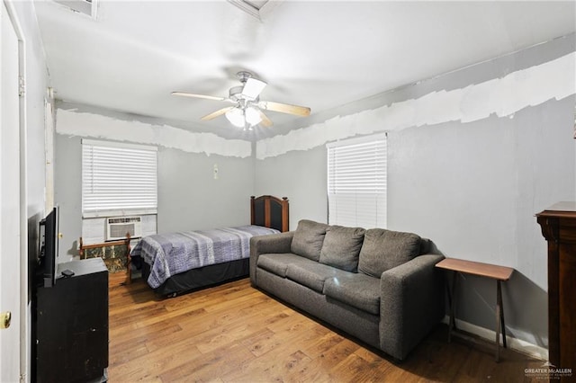 bedroom featuring a ceiling fan and wood finished floors