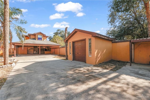 garage featuring a carport