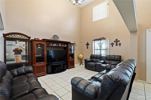 2315 E Sprague St, Edinburg, TX 78542 - living room with an inviting chandelier, light tile patterned floors, baseboards, and a high ceiling