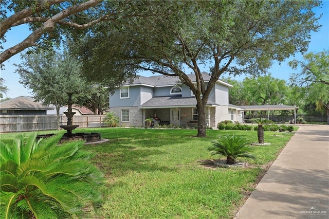 2315 E Sprague St, Edinburg, TX 78542 - traditional home with a detached carport, fence, stucco siding, and a front yard